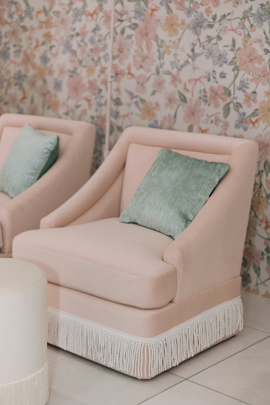 Fringed pink sofa